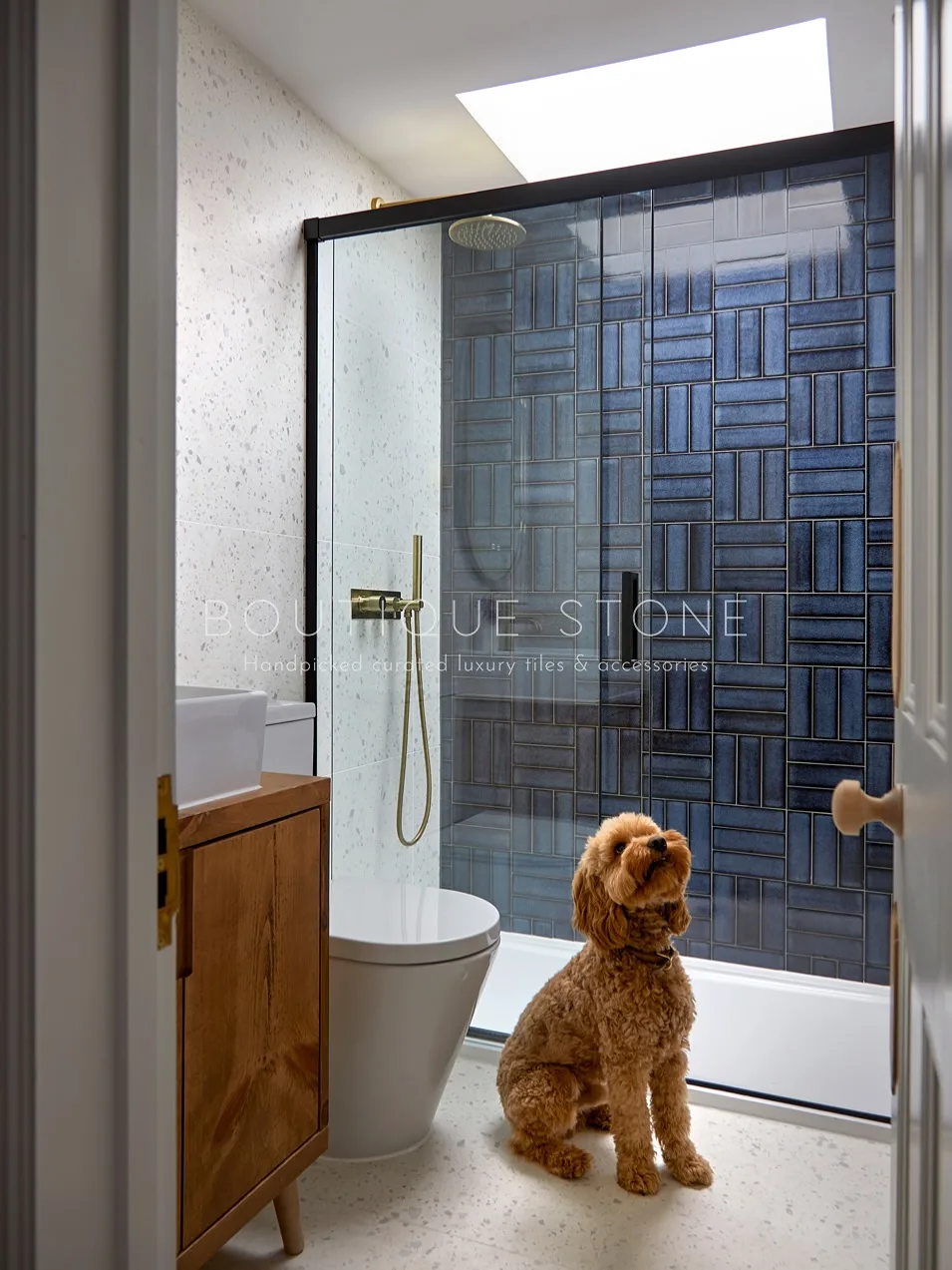 Hello Autumn! 🍂 As the chill sets in, take a moment to savour the last of the sunshine and unwind with a long, lovely shower after a busy week.

This contemporary-meets-classic bathroom by Rhian is pure calm, with a skylight that floods the space with natural light. I love how the deep blue walls and warm timber vanity balance the cool elegance of our Eccitare Terrazzo Zinc porcelain tiles keeping it inviting, never sterile.

And of course, Rio the cockerpoo stealing the show 🐾

Beautifully captured by @annastathakiphoto, who caught that perfect light streaming through.

More details on this transformation (and how to order samples of Eccitare Zinc Terrazzo or a similar Fjord Artisan Blue for the walls) are on our website.

Beautiful vanity by @woodandduck